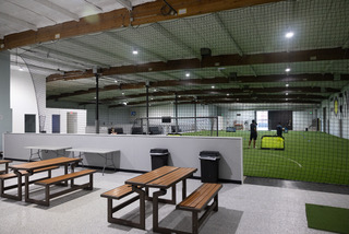 Tables and seating beside the Formula turf